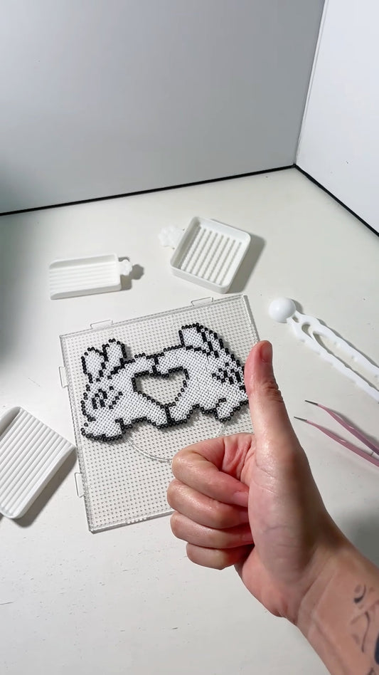 How to safely remove pixel bead artwork from pegboard using tape technique by FusePix