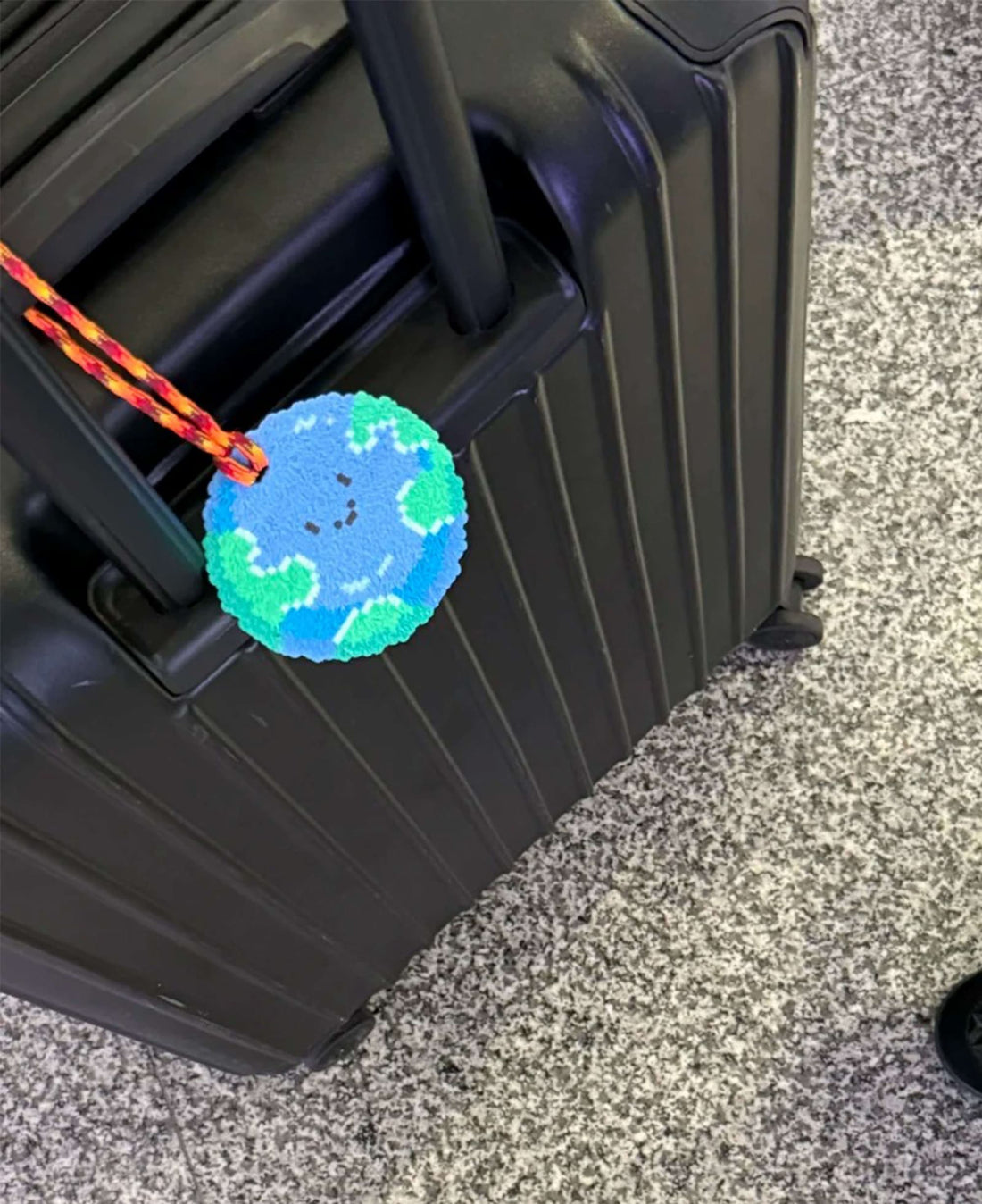 Earth travel tag pattern made with 2.6mm mini perler beads by FusePix